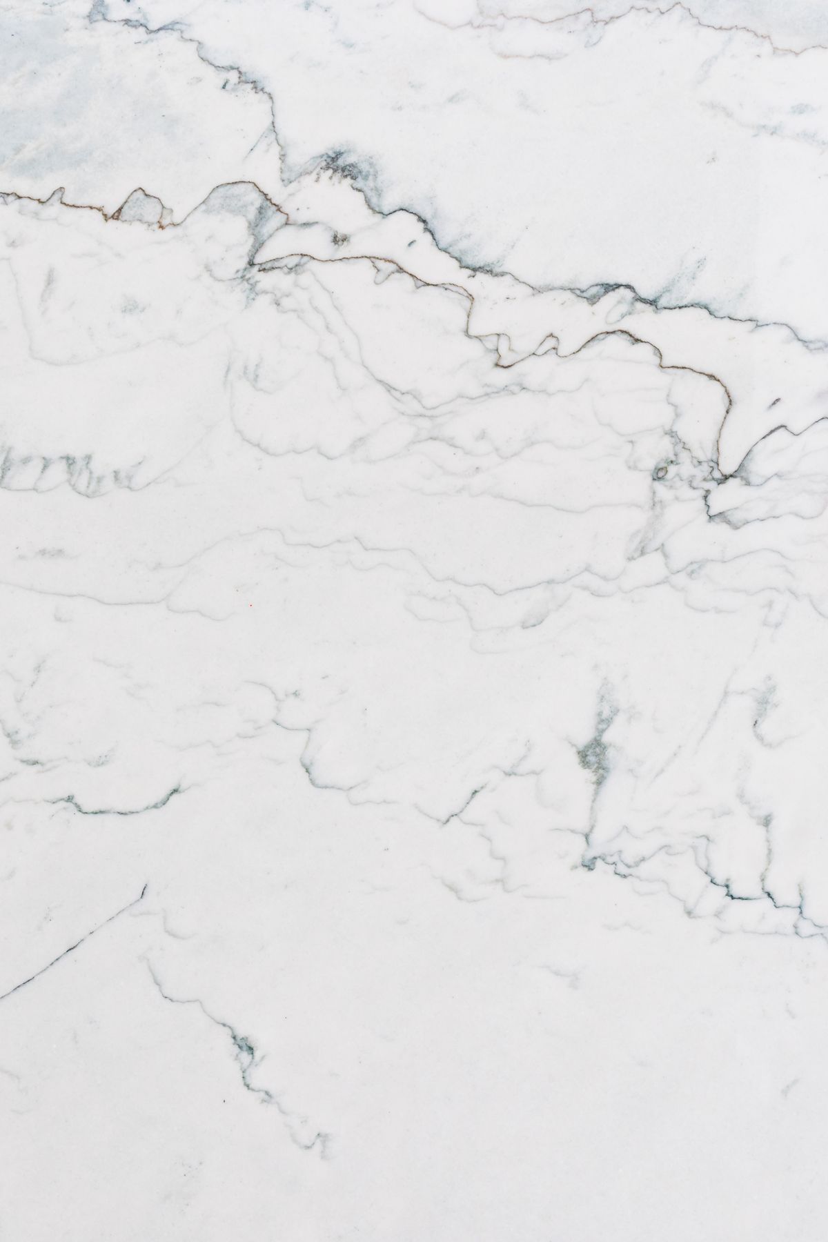 A natural quartz and marble countertop surface with soft grey veining