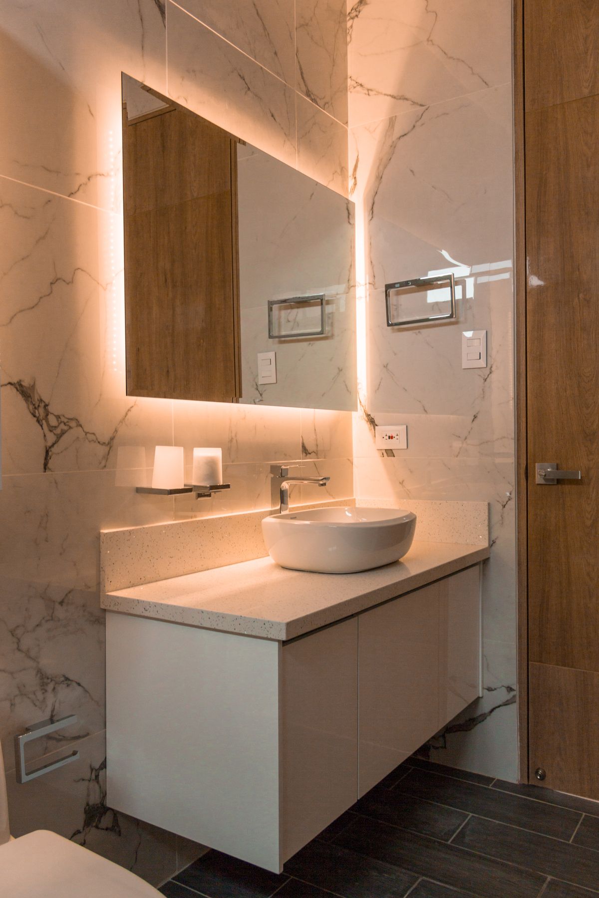 A vanity and lit mirror chosen as a pair to finish the room