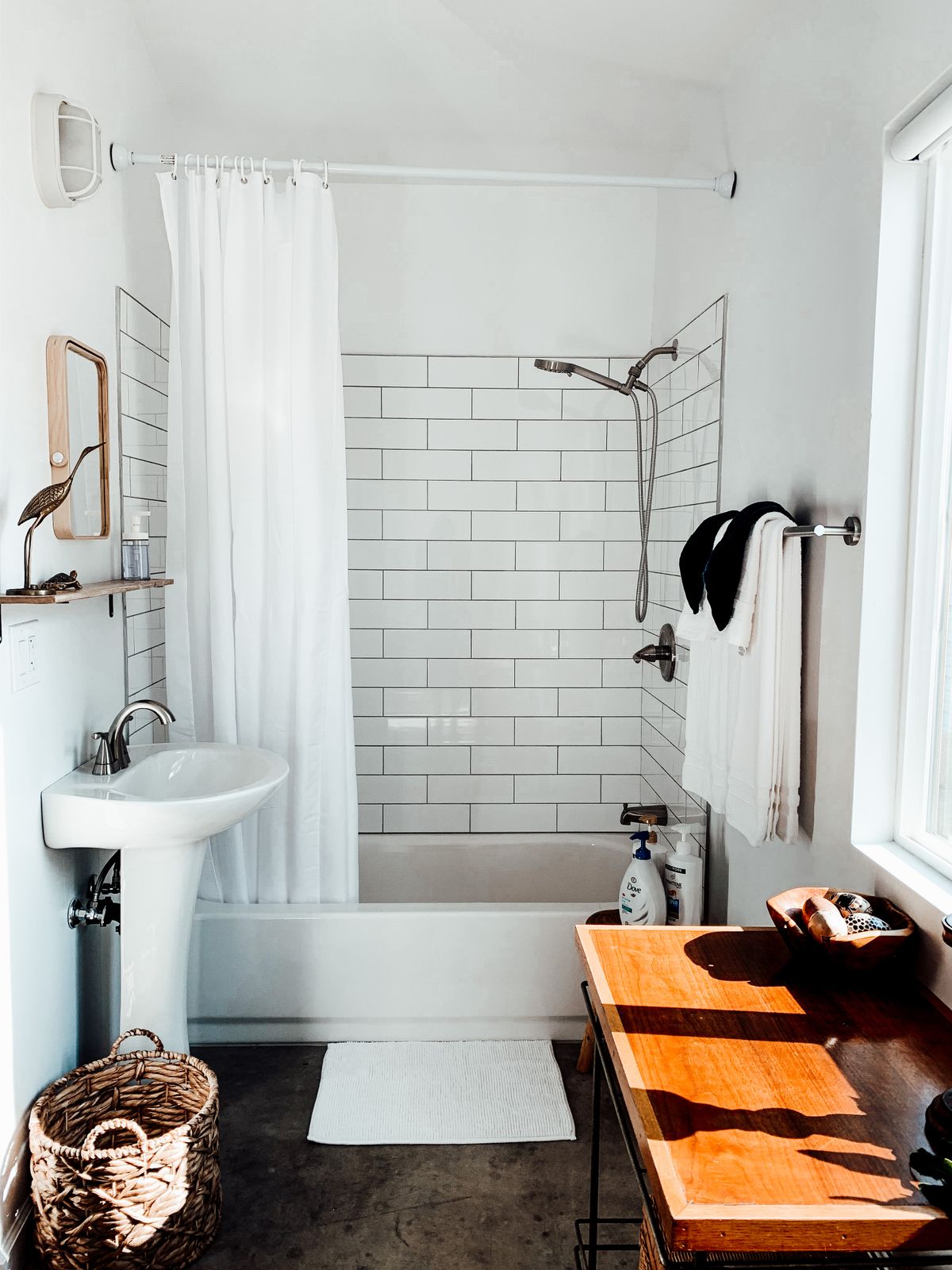 A classic pedestal sink and white subway tile, the kind of period detail worth keeping
